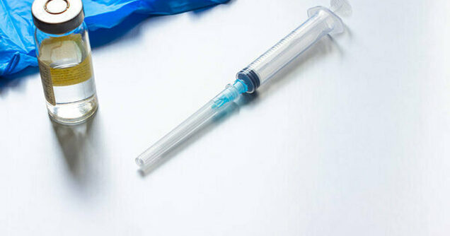 Depositphotos 444472356 free stock photo syringe vaccine table concept global